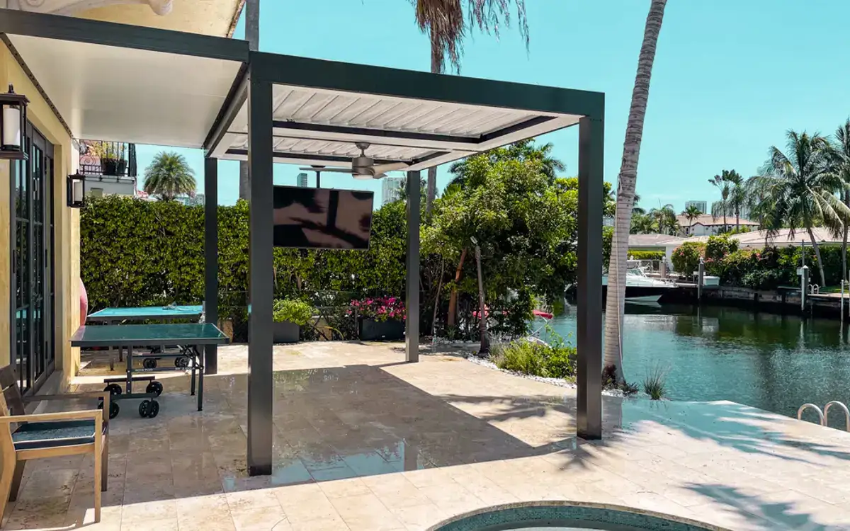 Freestanding louvered roof over a pool