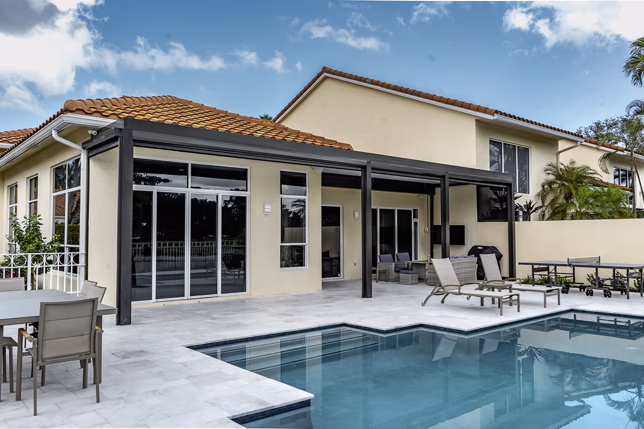 Aluminum patio cover over a pool paver deck